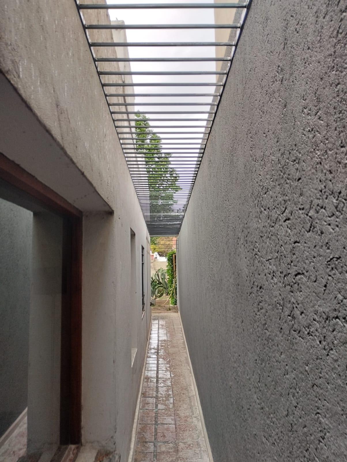 Medianera con fratazado texturado, proyecto de obra en Villa Carlos Paz